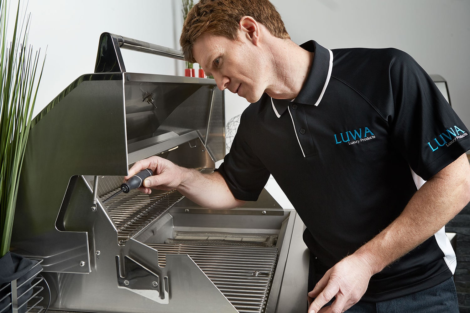 Luwa service technician working on Hestan grill